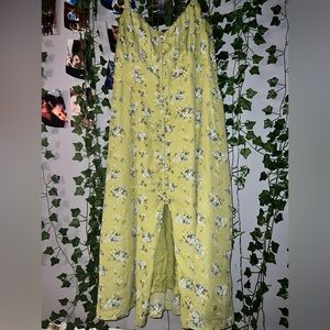A light green long dress w blue+white flowers and dark green vines